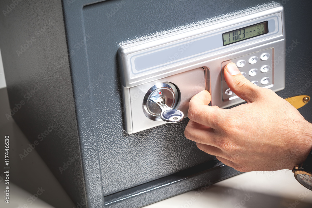 hand opened a safe, close up hand opened a safe, close up
