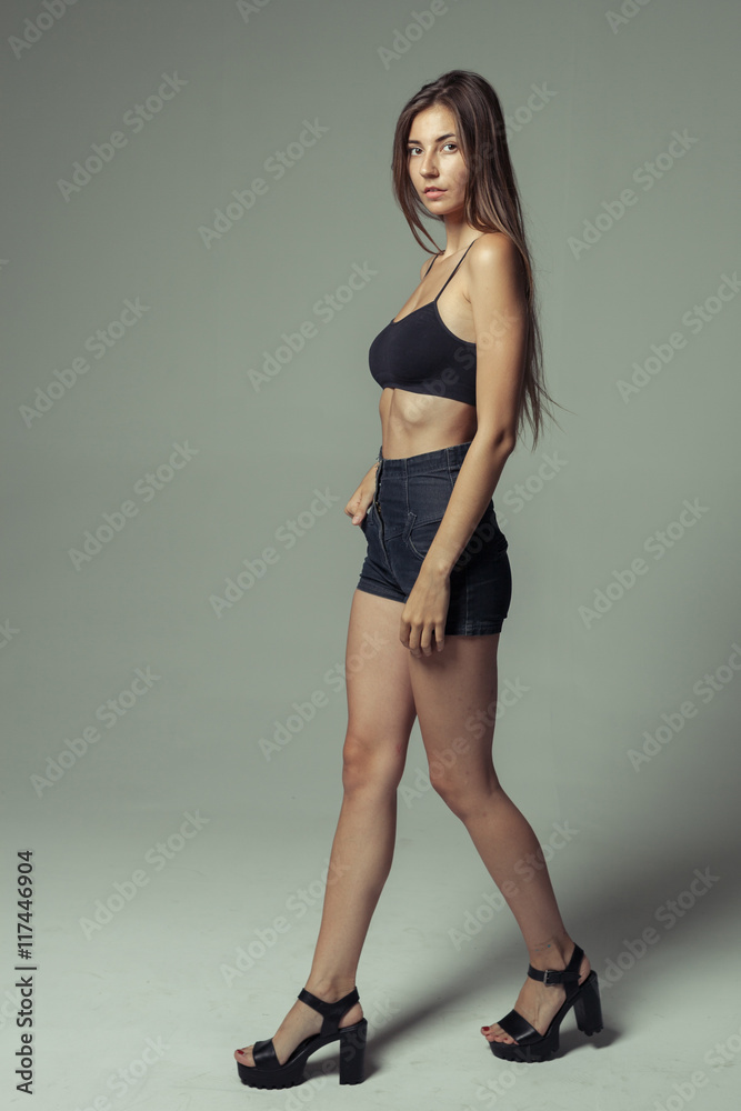 model tests of young pretty girl over grey background model tests of young pretty girl over grey background