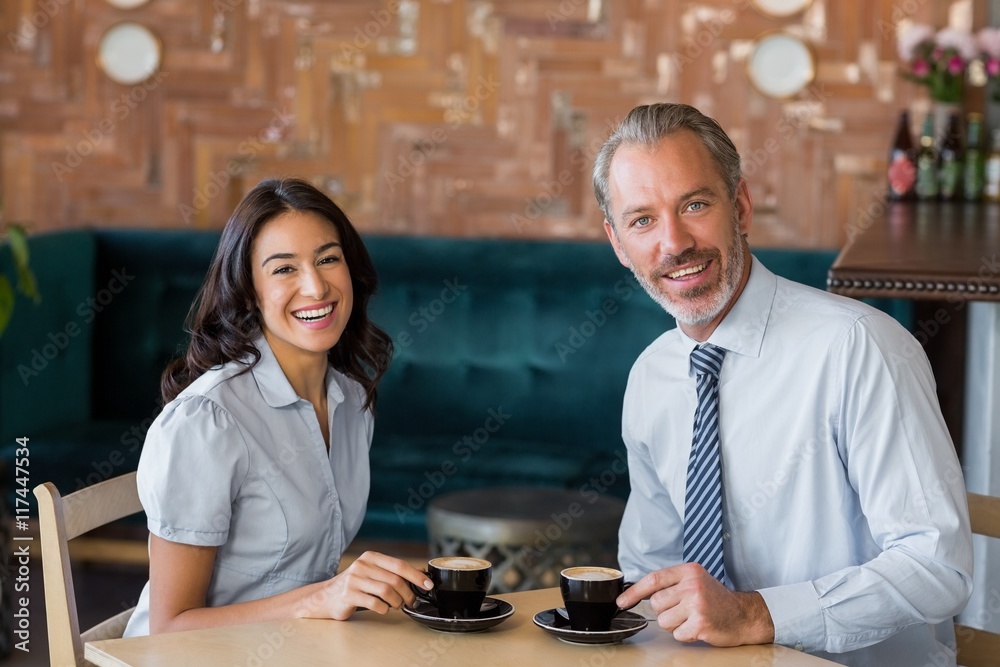 Man and woman meeting over coffee in restaurant
