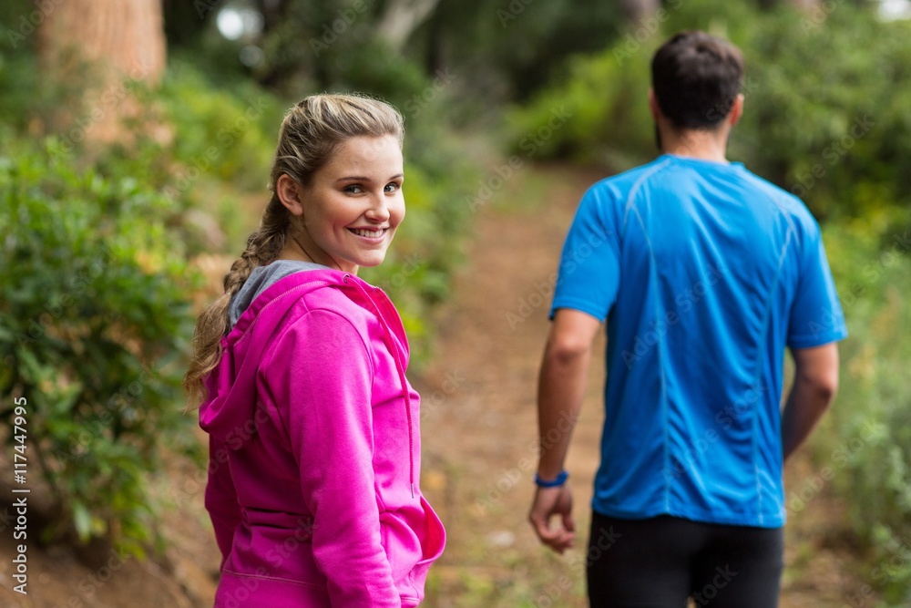 Woman looking back while taking walk Woman looking back while taking walk