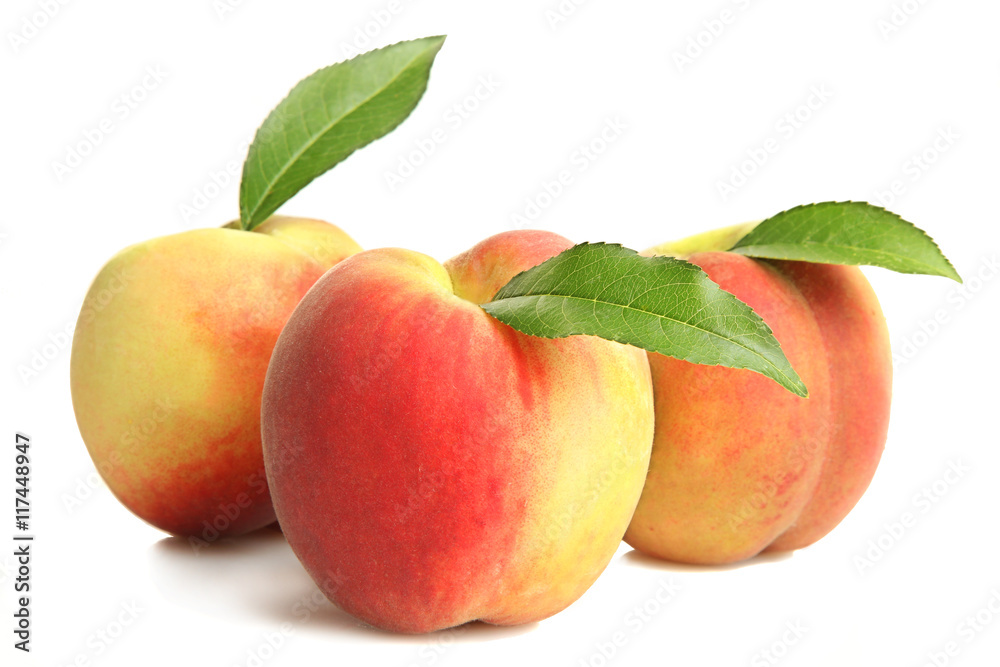 Peaches with leaf on white isolated background Peaches with leaf on white isolated background