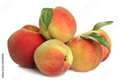 Peaches with leaves on white isolated background.