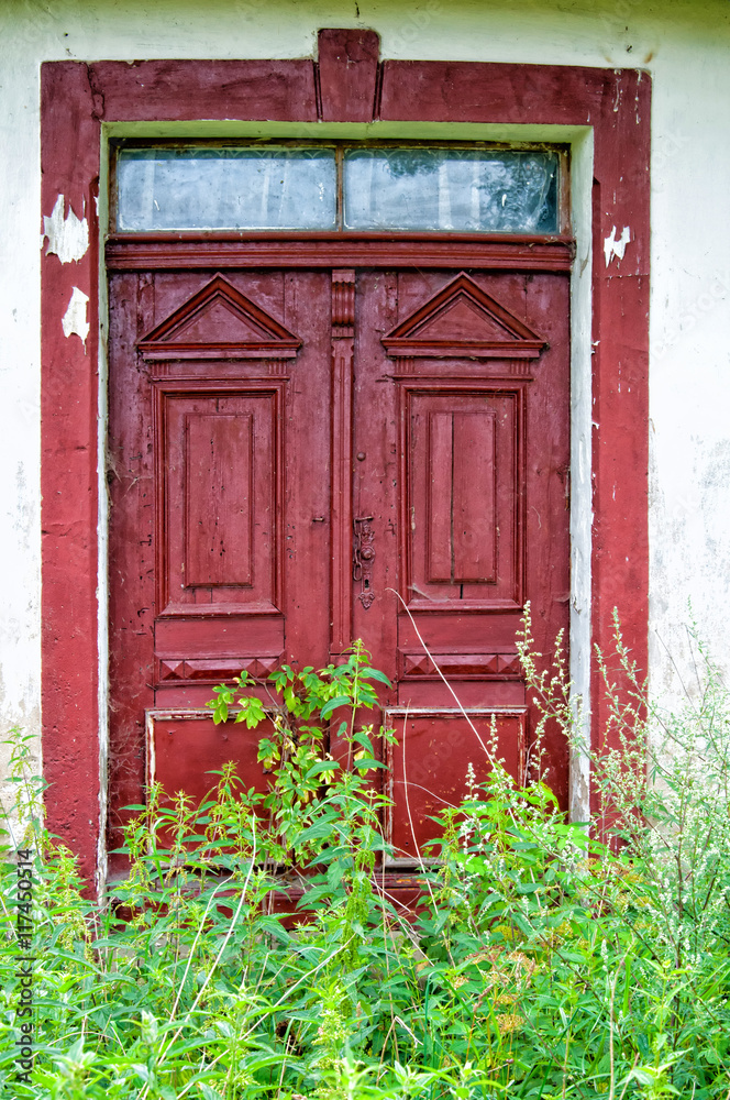Old door of an abandoned house in the countryside Old door of an abandoned house in the countryside