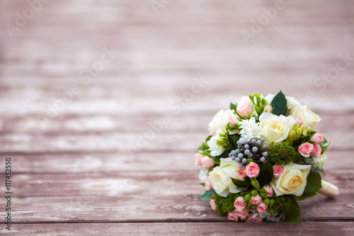 Beautiful wedding bouquet on vintage wooden background. Marriage concept