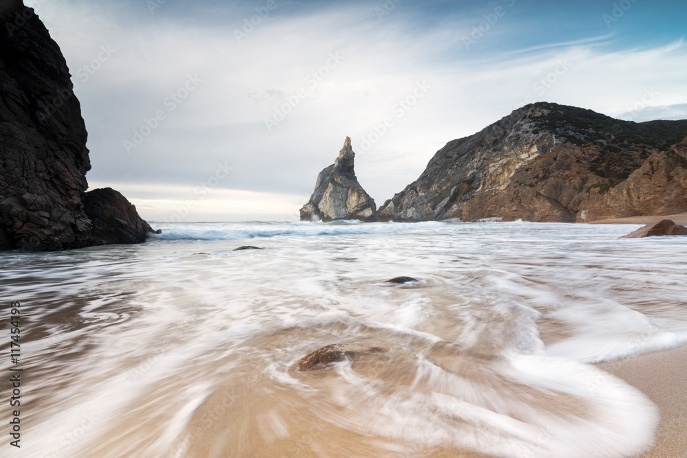 Ocean waves crashing on the sandy beach of Praia da Ursa surrounded by  cliffs, Cabo da Roca, Colares, Sintra, Portugal Stock Photo | Adobe Stock
