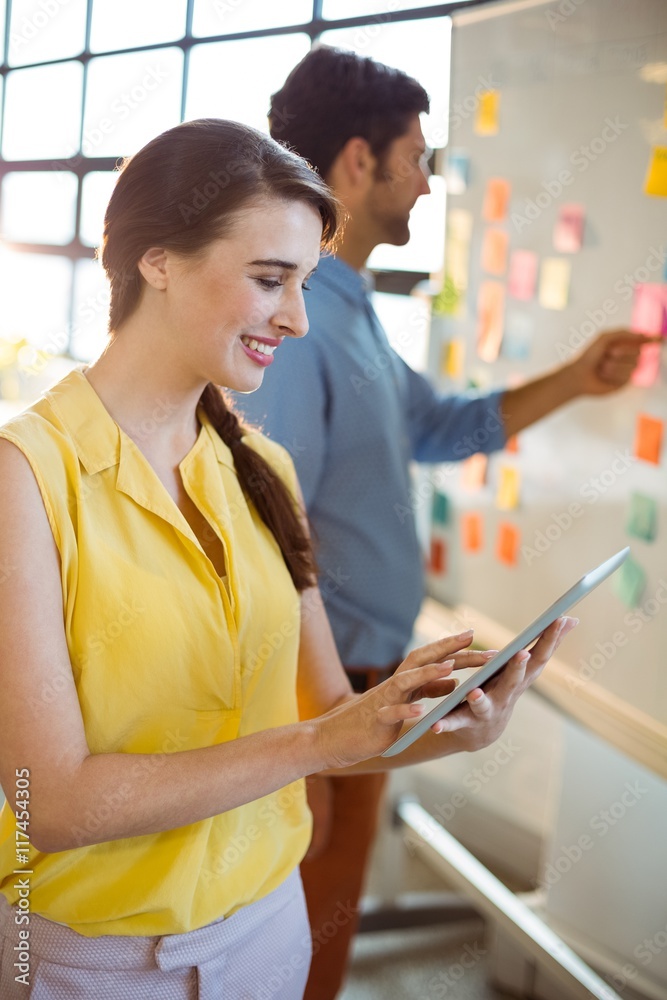 Female business executive using digital tablet Female business executive using digital tablet