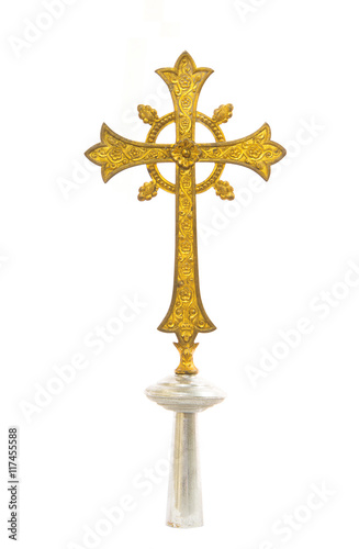 Antique gold cross on white background
