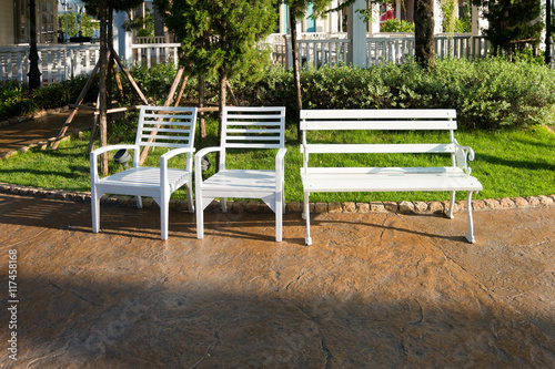 white wooden chairs on the street