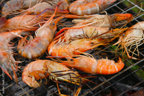 Grilled shrimps on the flaming grill.