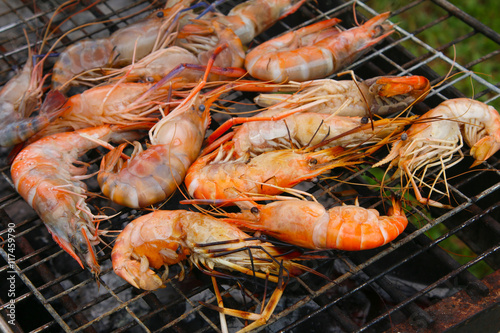 Grilled shrimps on the flaming grill.