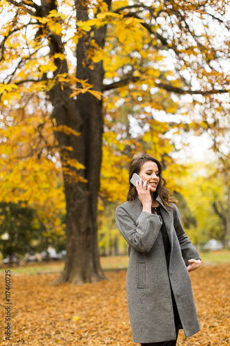 Young woman in the autumn park