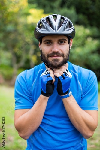 Male athletic wearing bicycle helmet