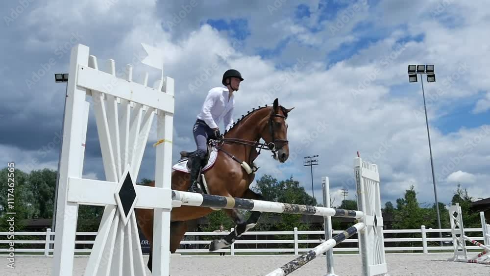 The man jumping over the barrier at the arena