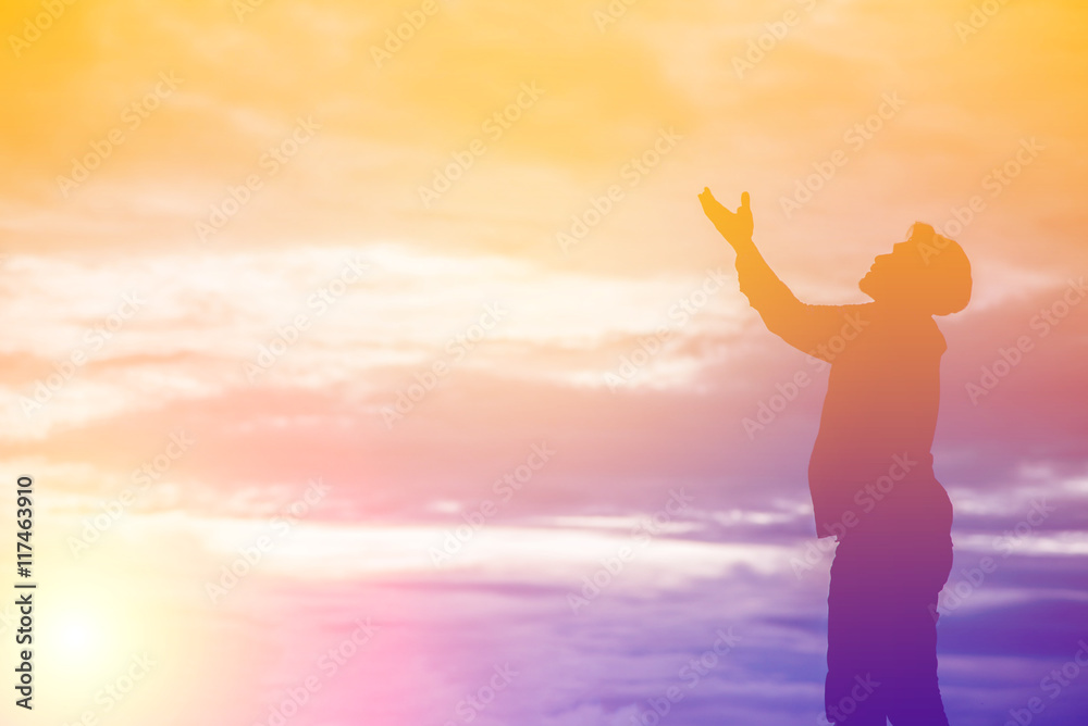 Silhouette of man praying during sunset Silhouette of man praying during sunset