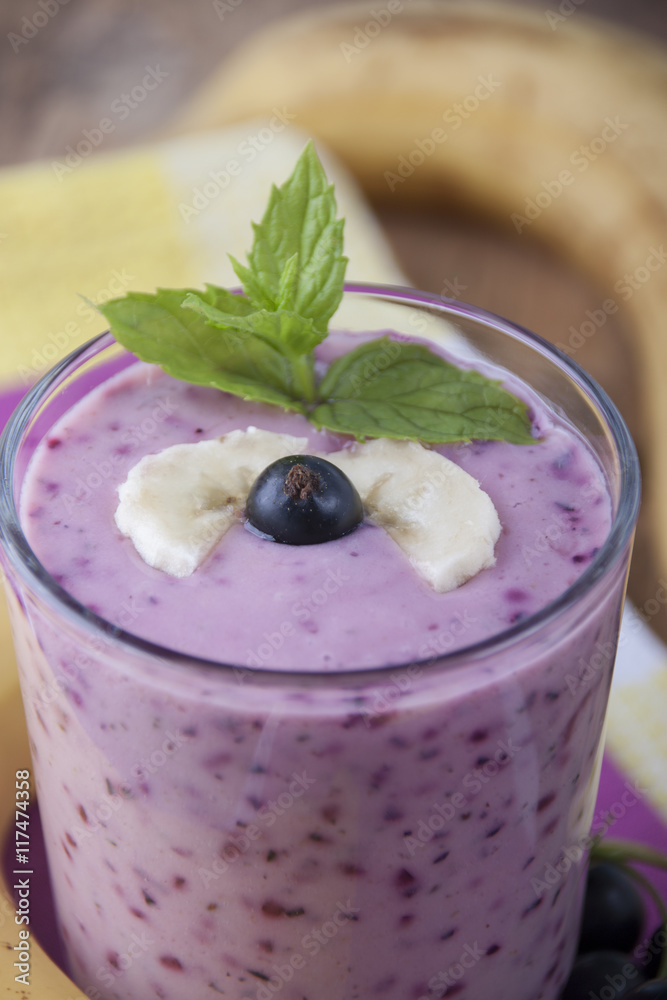 Smoothie of banana and black currant . Smoothie of banana and black currant .