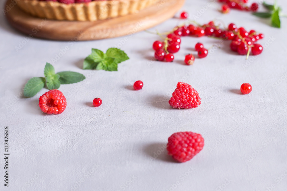 fresh raspberries and red currants and cake