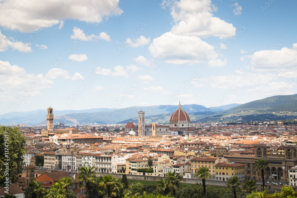 Magnificent view over the historical center of Florence in Italy. The photo is taken from piazzale Michelangelo and shows the Arno river, the Duomo and many other churches and buildings
