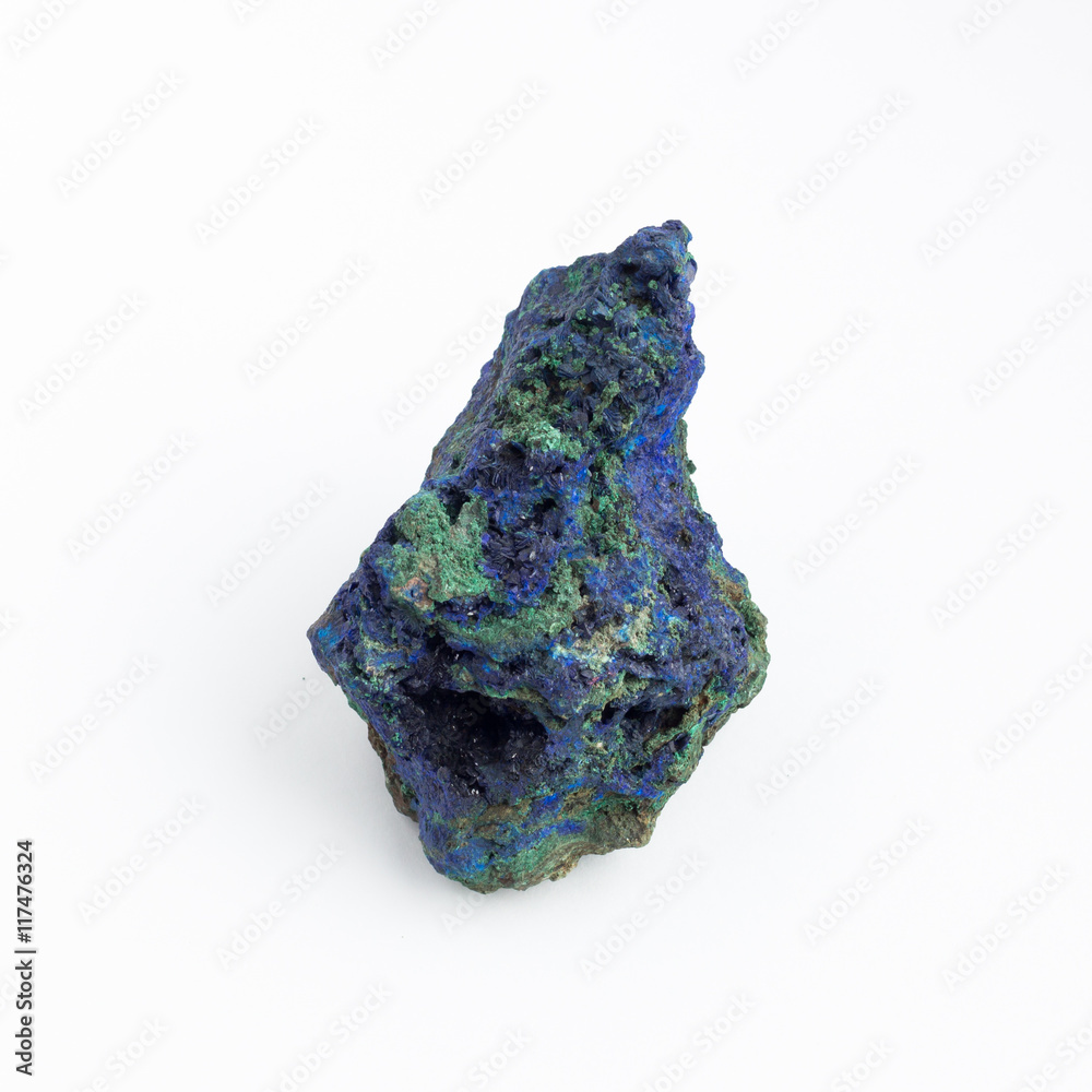 Stone similar to an asteroid on a white background Stone similar to an asteroid on a white background