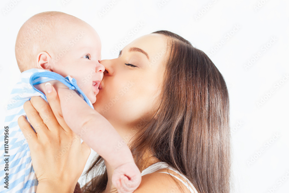 Happy mother holding a baby boy at white background Happy mother holding a baby boy at white background