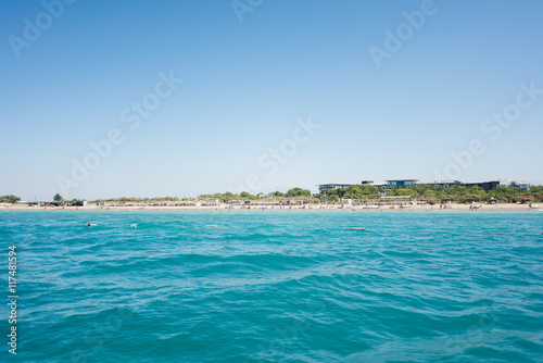 The Mediterranean sea view from the boat on the hotel beach with bungalows © zlatamarka