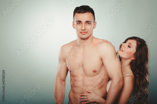 Sexy couple. Half naked man and woman in lingerie.
