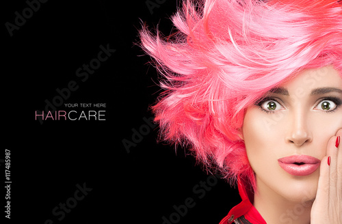 Fashion model girl with stylish dyed pink hair
