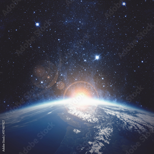 Fototapeta Naklejka Na Ścianę i Meble -  Sunrise over the Earth. Elements of this image furnished by NASA