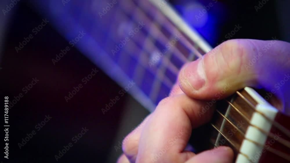 Crook pluck the strings on the guitar fretboard Crook pluck the strings on the guitar fretboard