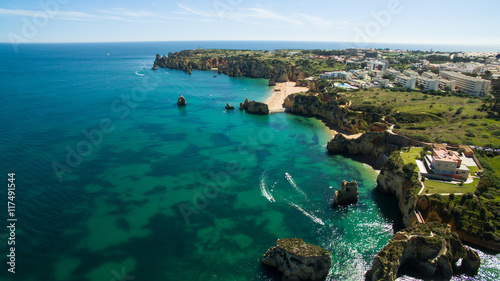 Beautiful ocean beach and cliffs in the south of Portugal, Lagos aerial view © vitfedotov