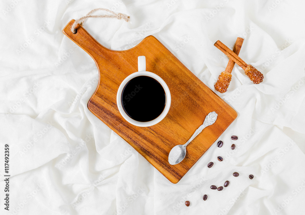 Naklejka premium Having a cup of coffee in bed