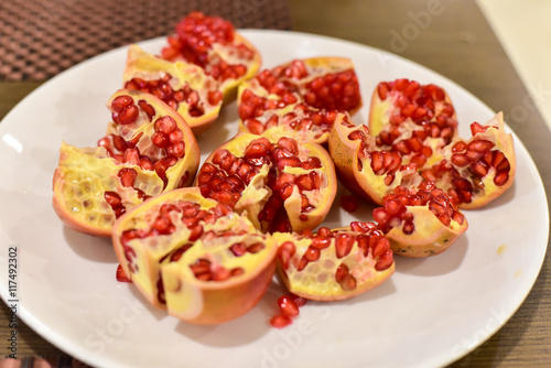 Close-Up of Red Pomegranates on a White Plate