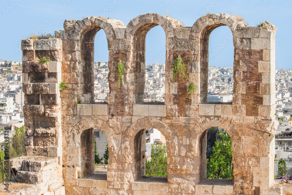 Present through the windows of the past - Landscape view of Athens, Greece through the archs of Herodes Atticus theater in Acropolis. 