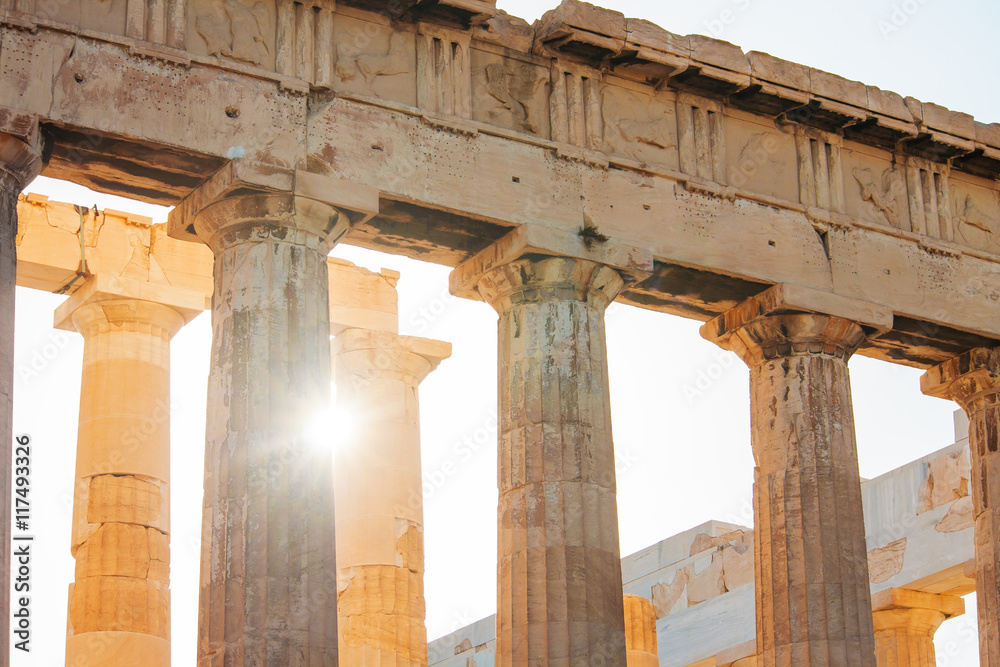 The Sun shines through the colonnade of the Parthenon in Athens, Greece.