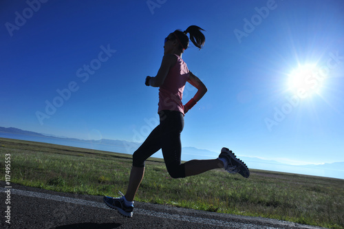  young fitness woman runner running on sunrise seaside trail © lzf