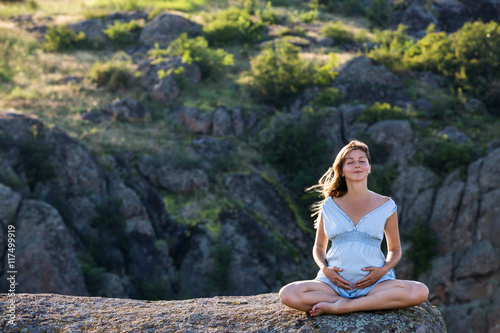 Pregnant woman in harmony with nature