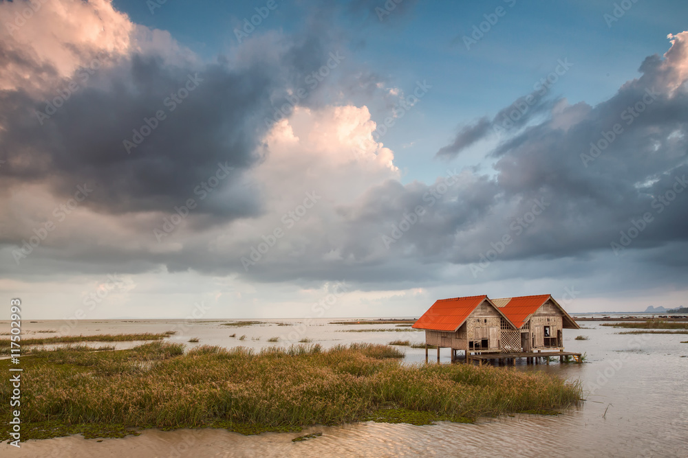 abadonded hut on dam with nice sky