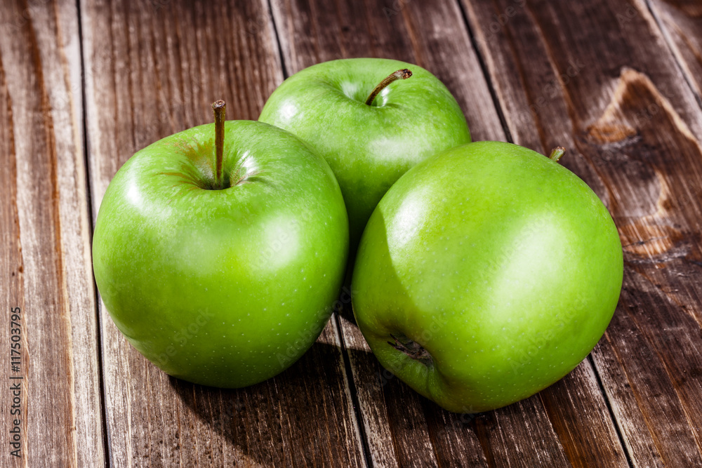 green apple fruit on a wooden background green apple fruit on a wooden background