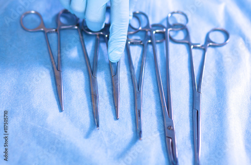 surgical instruments, laid out on an operating table