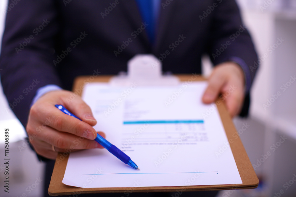 Businessman holding a blank white board