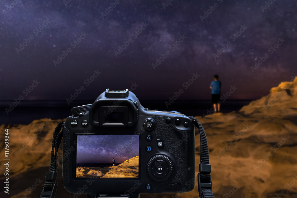 Fototapeta premium Camera shooting night sky at coast