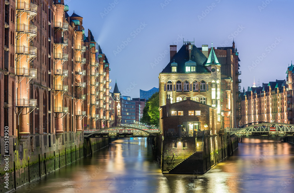 Hamburg, Germany - Popular Water Castle at night in the warehous