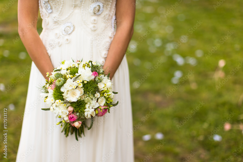 Lovely wedding bouquet in bride's hands Lovely wedding bouquet in bride's hands