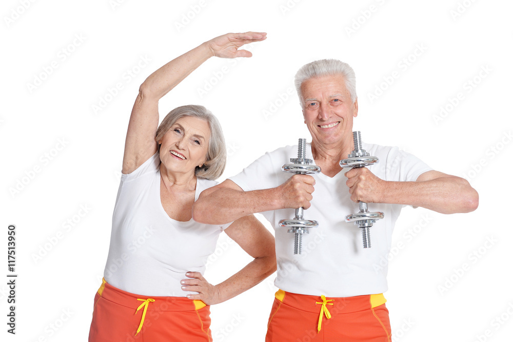 Senior Couple Exercising with dumbbells Senior Couple Exercising with dumbbells