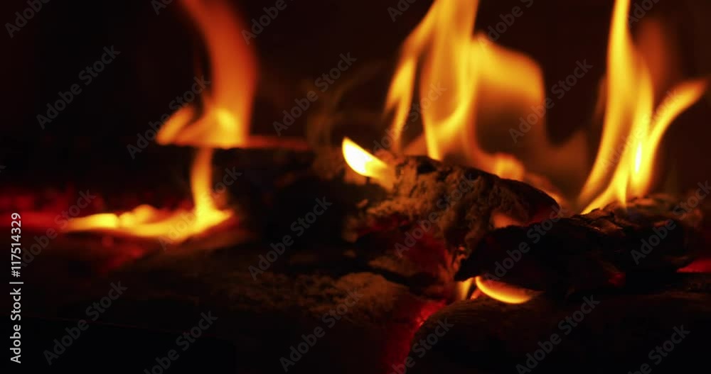 close up flames in a fireplace with wood coal close up flames in a fireplace with wood coal
