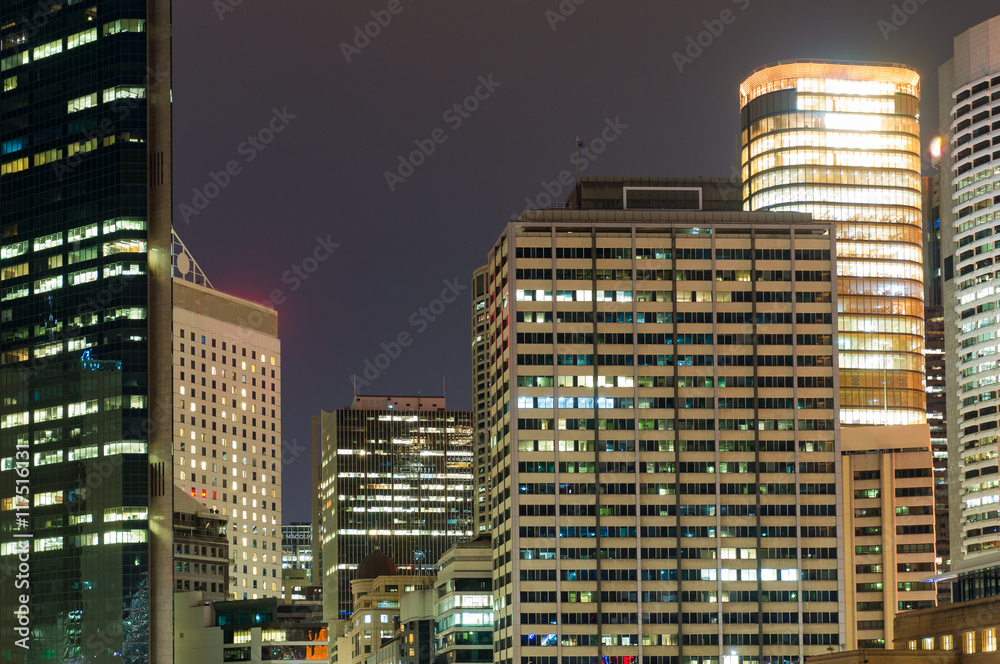 Modern cityscape at night background. Skyscrapers of Sydney downtown at dusk. Copy space, long exposure
