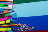 School or office stationery on colorful background. Back to School. Frame, copy space. Top view. supplies