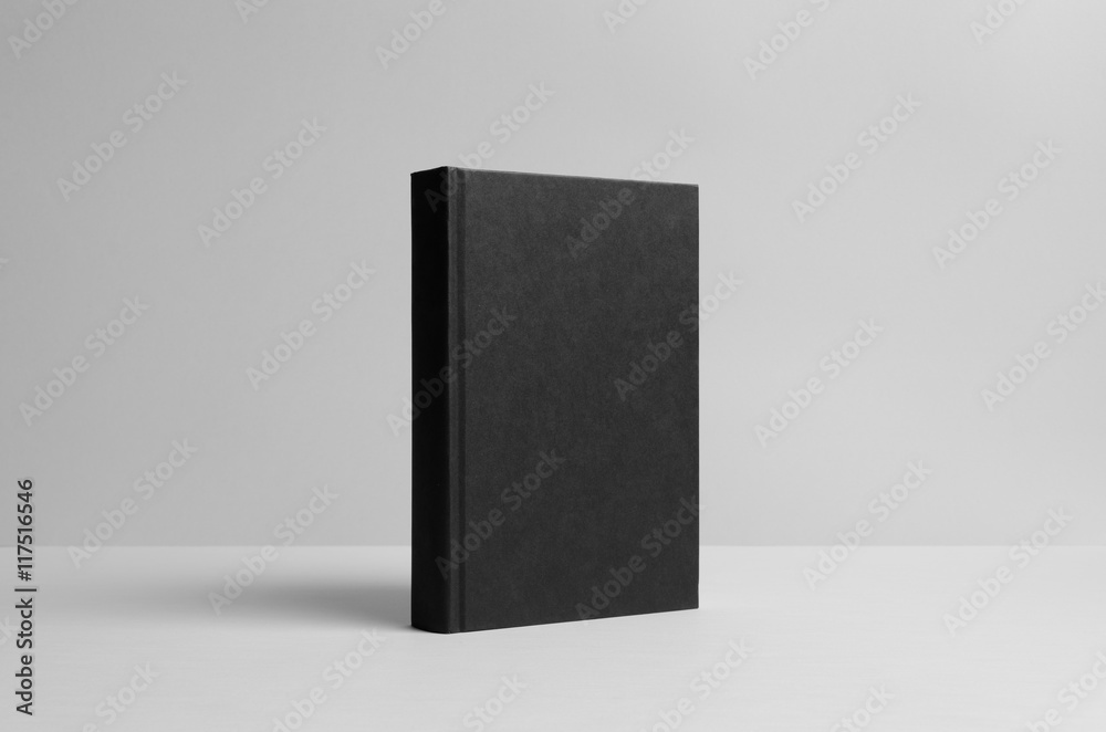 Black Hardcover Book Mock-Up - Wall Background Black Hardcover Book Mock-Up - Wall Background