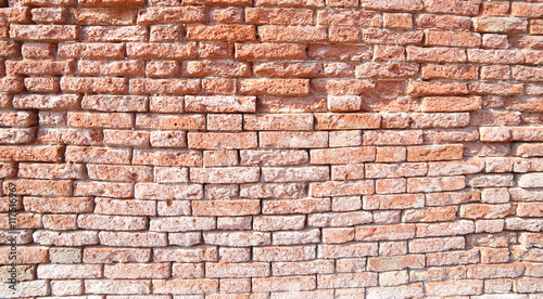 red brick wall of old chipped in an House