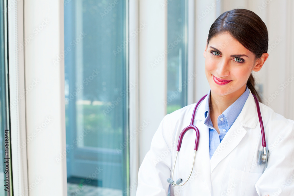 Happy female doctor with stethoscope around neck Happy female doctor with stethoscope around neck