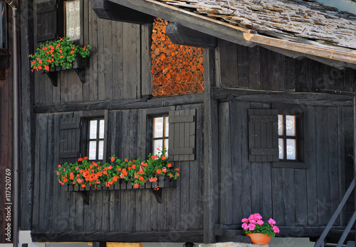 typical wood houses facade in alps town in Valle d'Aosta, Italy